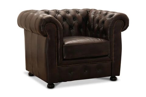Tumma ruskea Birmingham-nojatuoli Chesterfield-tyyliin, nappikoristeltu selkänoja ja koristeniitit.