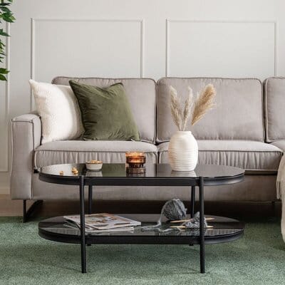 Bayonne ovaalin muotoinen sohvapöytä, jossa savunharmaa lasikansi ja musta metallirunko