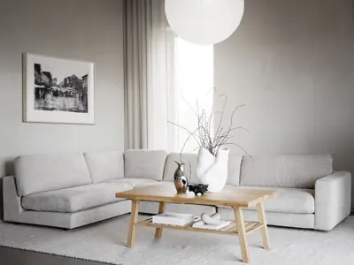 Rowico Home Duncan avokulmasohva vaaleanharmaalla kangasverhoilulla modernissa olohuoneessa. Tilava avokulmasohva sopii suureen oleskelutilaan ja rentoon yhdessäoloon.